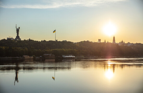 View of Kyiv from left bank of Dnipro river at sunset