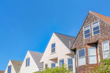 Gable houses' peaks with wood sidings in San Francisco, CA