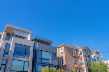 Modern and traditional designs of houses in a low angle view in San Francisco, CA