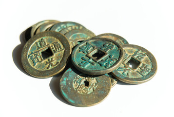 Many ancient Chinese coins on a white background