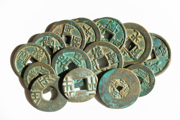Many ancient Chinese coins on a white background
