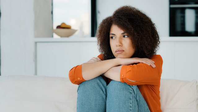 Alone Lonely Stressed African American Woman Sitting With Sad Problem At Home Couch Thinking About Trouble Looking Away Bad Health Stress Frustrated Girl Feeling Unwell Sadness Fail Wrong Decision