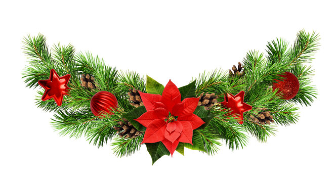 Christmas waved garland with red pionsettia flower, pine twigs and decorations