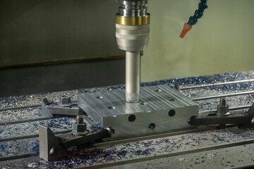 The CNC milling machine rough cutting the injection mold parts by indexable tools.