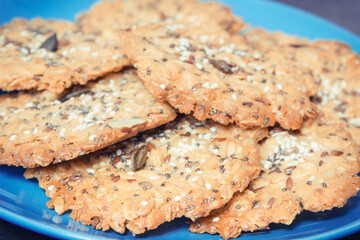 Fresh baked homemade healthy oatmeal cookies on blue plate. Delicious dessert
