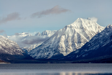 winter scene of snow covered mountains above Lake McDonald, Glacier National Park, Montana