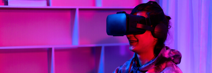 Man wears virtual reality glasses and uses joystick to play games with fun, VR, Future games,...