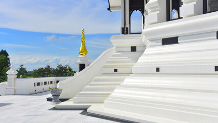 Pagoda Wat Pa Ban Tat temple, Gold temple with beautiful cloudy in Udon Thani Thailand.