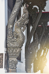 Black naga Carved, on rooftop at Wat Pa Ban Tat temple in Udon Thani Thailand.