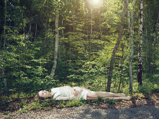 the woman sleeping in the forest.