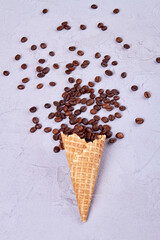 Waffle ice cream cone with coffee beans. Vertical shot dessert for drink on white background.