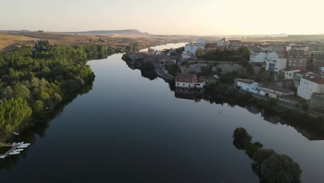 Beautiful aerial views of the Tormes River as it passes through the medieval town of Alba in the province of Salamanca, Spain.