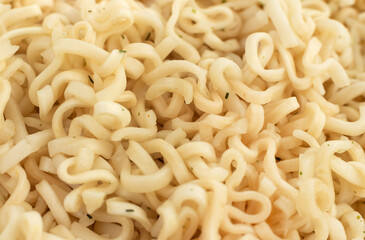 Background of instant noodles close-up with seasonings. Pasta