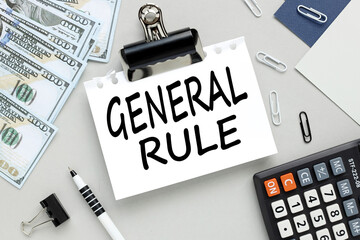 Fototapeta premium money and calculator. text on notepad on gray background. GENERAL RULE