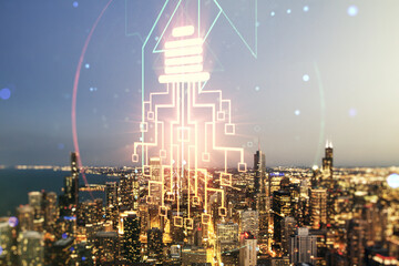 Virtual creative idea concept with light bulb and microcircuit illustration on Chicago skyline background. Neural networks and machine learning concept. Multiexposure