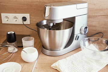Silver food processor in kitchen interior, kitchen electric mixer on table, Modern kitchen...