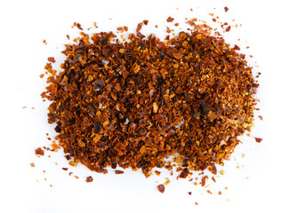 Ground chili pepper isolated on white background. Top view, close-up.