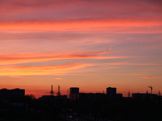 Obraz na płótnie Canvas Bright sunset sky over the silhouette of the evening city. City of Lviv skyline at sunset