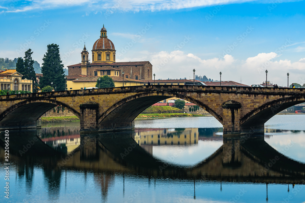 Wall mural san frediano in cestello church with bridge ponte alla carraia over arno river in florence.