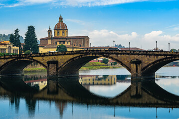 San Frediano in Cestello church with bridge Ponte alla Carraia over Arno river in Florence.