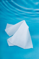 Naklejka premium One wet wipe isolated on blue