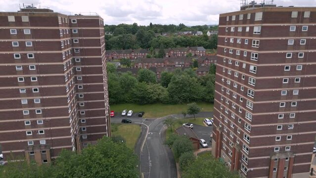Generic aerial view of British council housing tower blocks and town streets