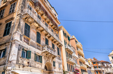 City scapes and traditional architecture of Corfu Greece with tourists enjoying the sights	