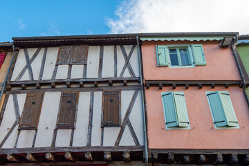 Old framework houses at main square of medieval village Mirepoix in southern France