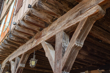 Old framework houses at main square of medieval village Mirepoix in southern France