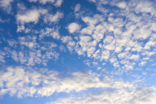 Bright Blue Sky with Light Pink Clouds