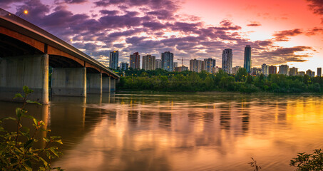 Edmonton skyline and Groat Bridge at dramatic sunrise at Emily Murphy Park, over North Saskatchewan...