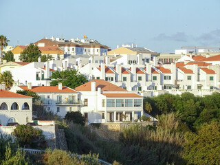 View of white houses with orange roofs in the Portuguese town Sines