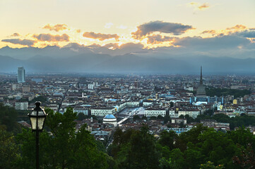 Naklejka premium Panoramic scenic view of city downtown from the hill at sunset Turin Italy