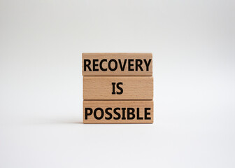 Recovery is possible symbol. Concept words Recovery is possible on wooden blocks. Beautiful white background. Business and Recovery is possible concept. Copy space.