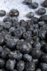 Macro close up of unwashed blueberries.