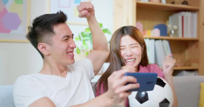 happy couple using smartphone