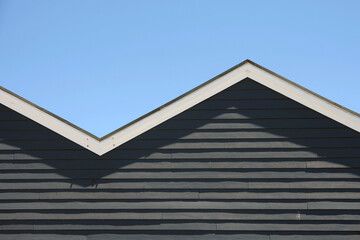 Zigzag shaped roof front under blue sky