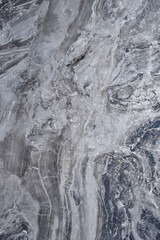 Gray, black marble texture. Marble surface background. Striped marble surface with grains and tracery.