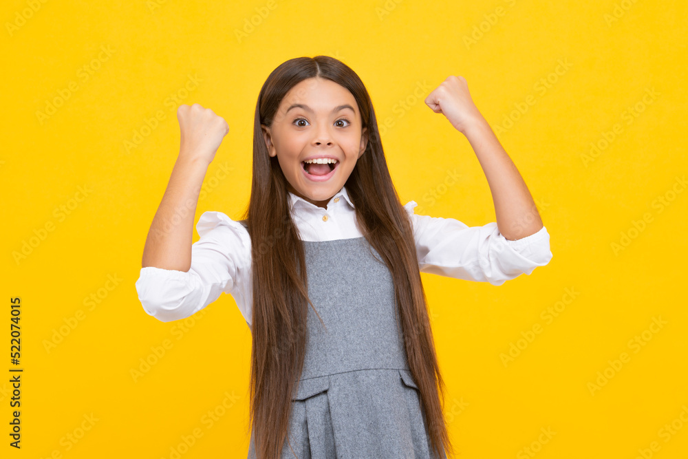 Poster amazed teen girl. excited expression, cheerful and glad. joy, victory, celebration and excitement co