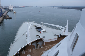 View from open decks of legendary luxury ocean liner cruise ship on sunny day twilight sunset...