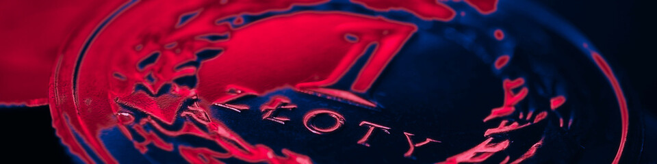 Translation: 1 zloty. Polish one zloty coin close-up. National currency and money of Poland. Dark red and blue tinted banner or headline. News about economy or finance. Looks like glow of neon. Macro