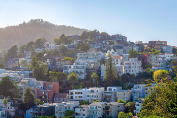 Modern residential buildings on a mountain against the faint skyline at San Francisco, California