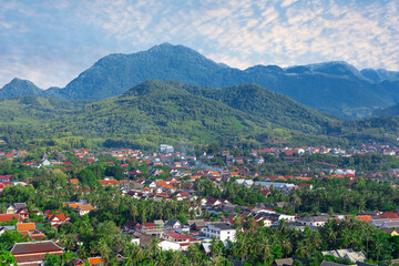 Luang Prabang Laos surrounded by the high mountains and the Mekong River. This lovely city is nestled in the high mountains and tropical rainforest