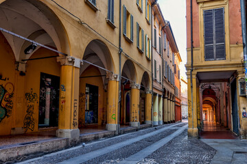 Fototapeta na wymiar Building facades and medieval architecture along the streets in Bologna