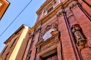 Building facades and medieval architecture along the streets in Bologna