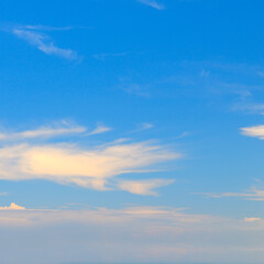 Blue skies and light wispy clouds.