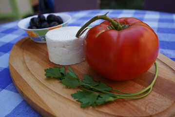 Board of fresh vegetables and Greek feta cheese