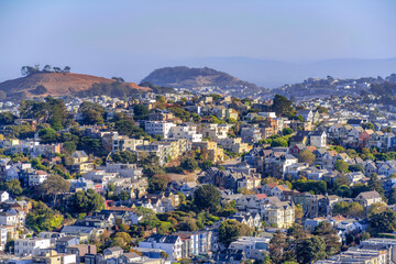 Fototapeta na wymiar Row of residential buildings on a sloped suburbs of San Francisco, California