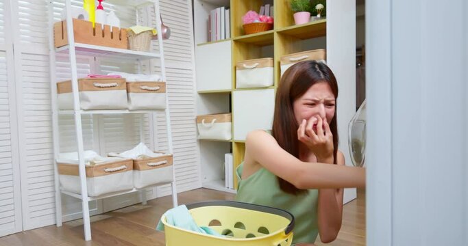 woman dissatisfied laundry smell