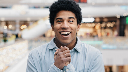 Front view portrait emotions enthusiastic surprised shocked amazed man african american guy teen...